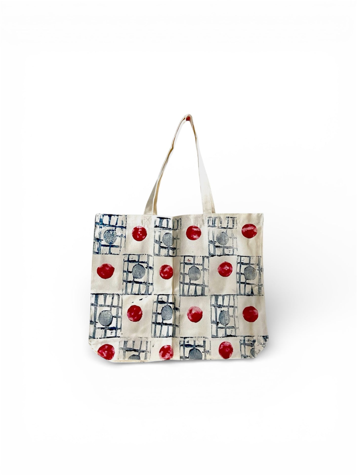 Handcrafted cotton canvas tote bag with a colorful polka dot design, perfect for eco-friendly everyday use.