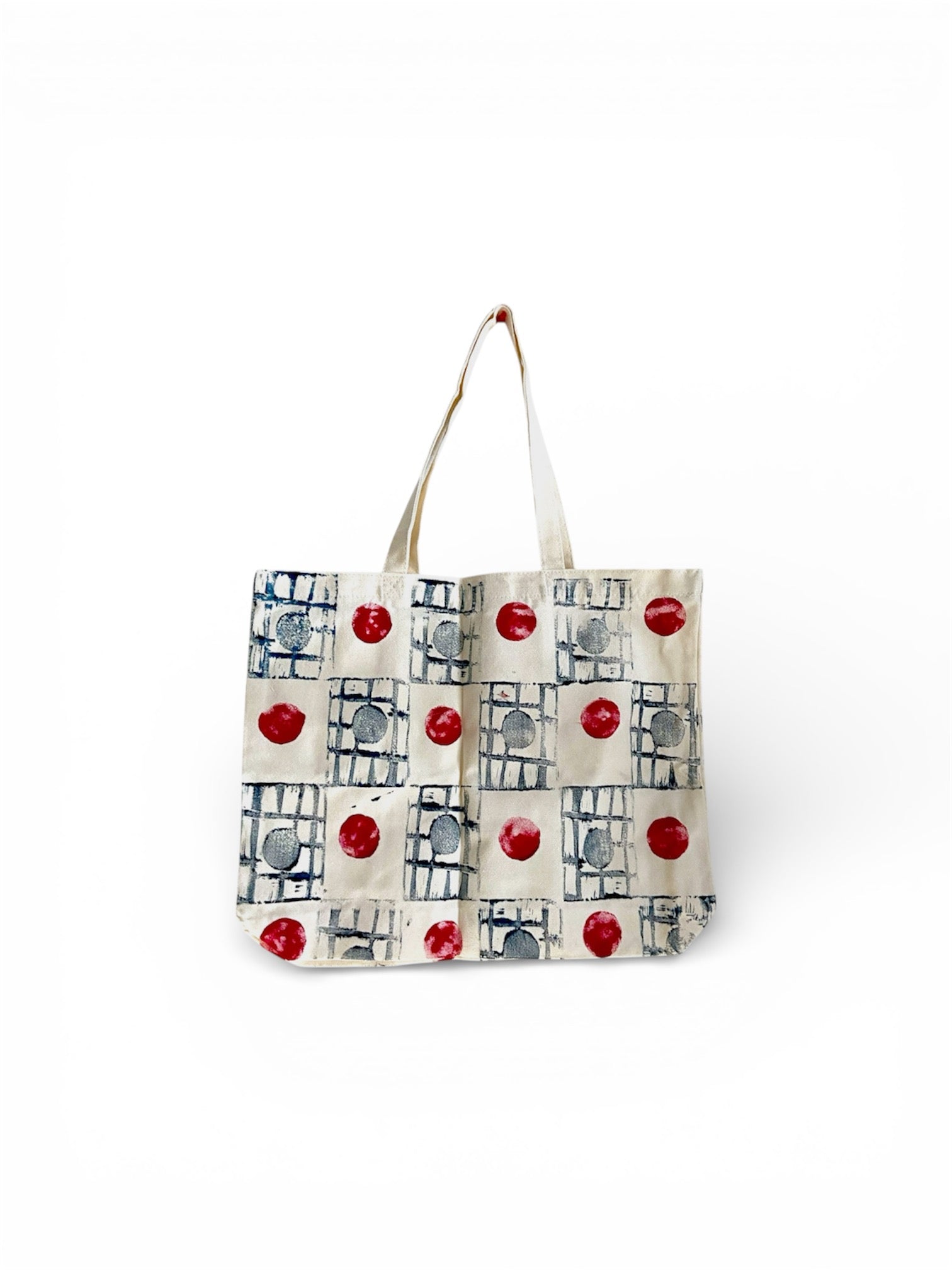 Handcrafted cotton canvas tote bag with a colorful polka dot design, perfect for eco-friendly everyday use.