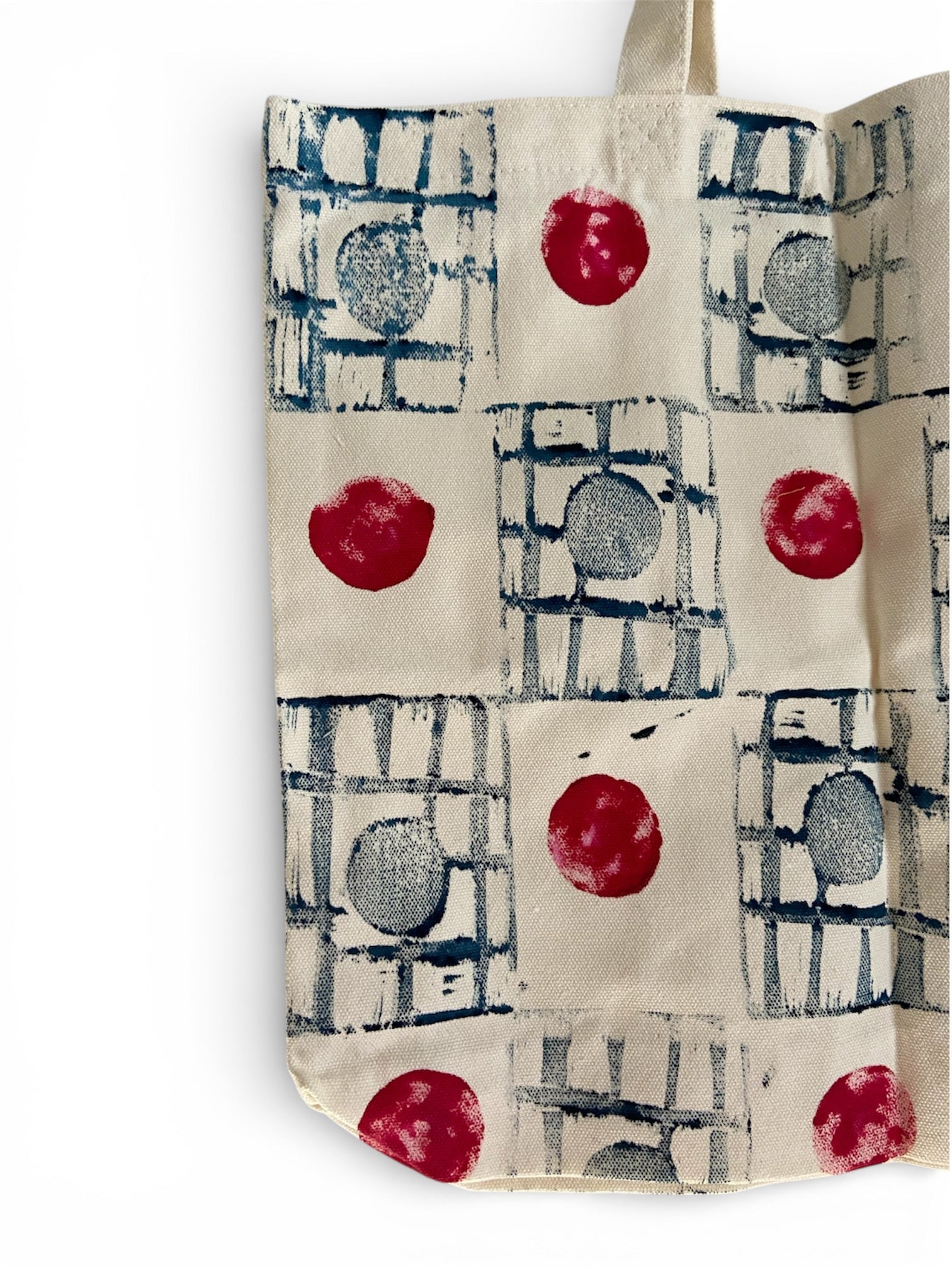 Handcrafted cotton canvas tote bag with a colorful polka dot design, perfect for eco-friendly everyday use.
